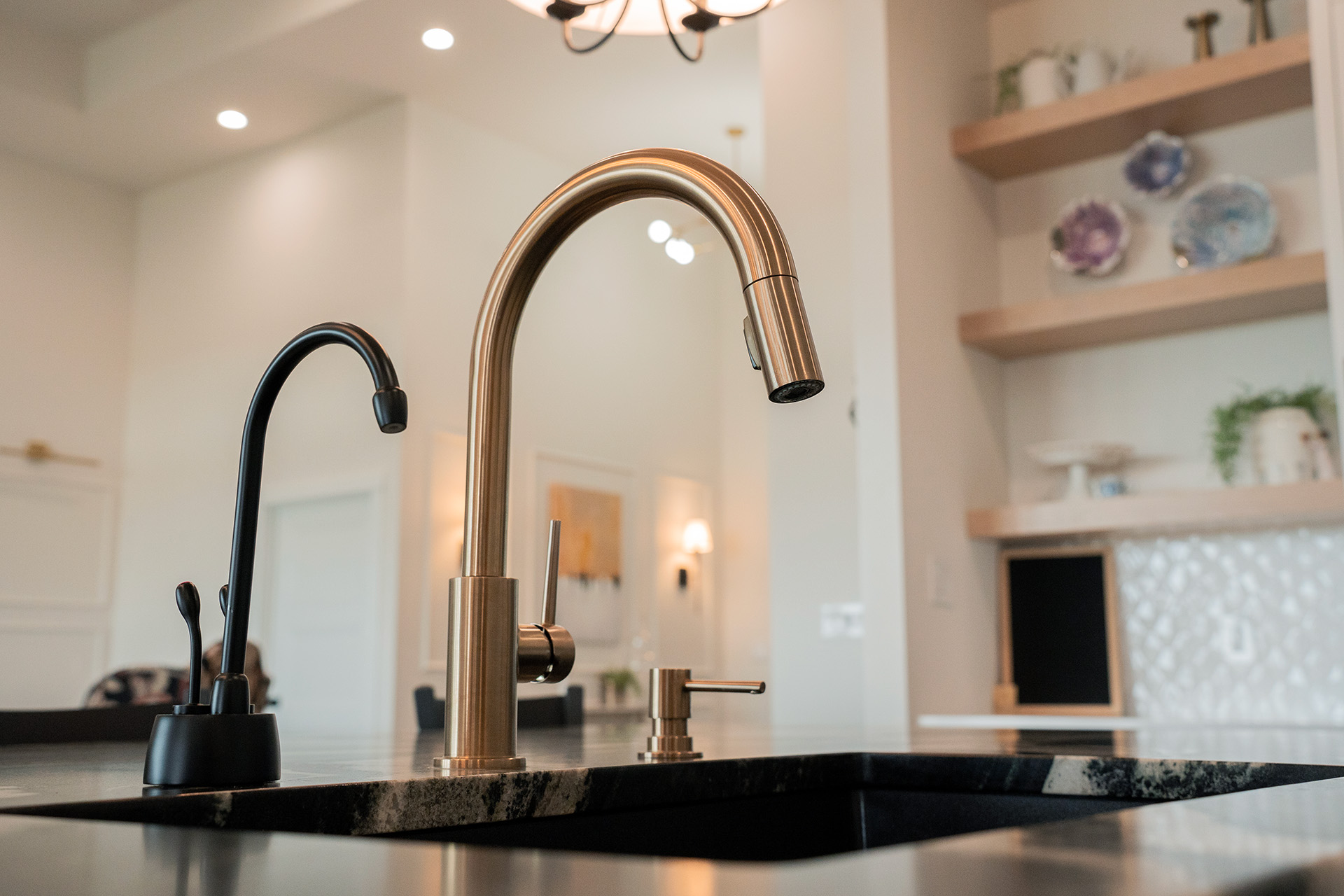 Gold faucet detail in the custom kitchen